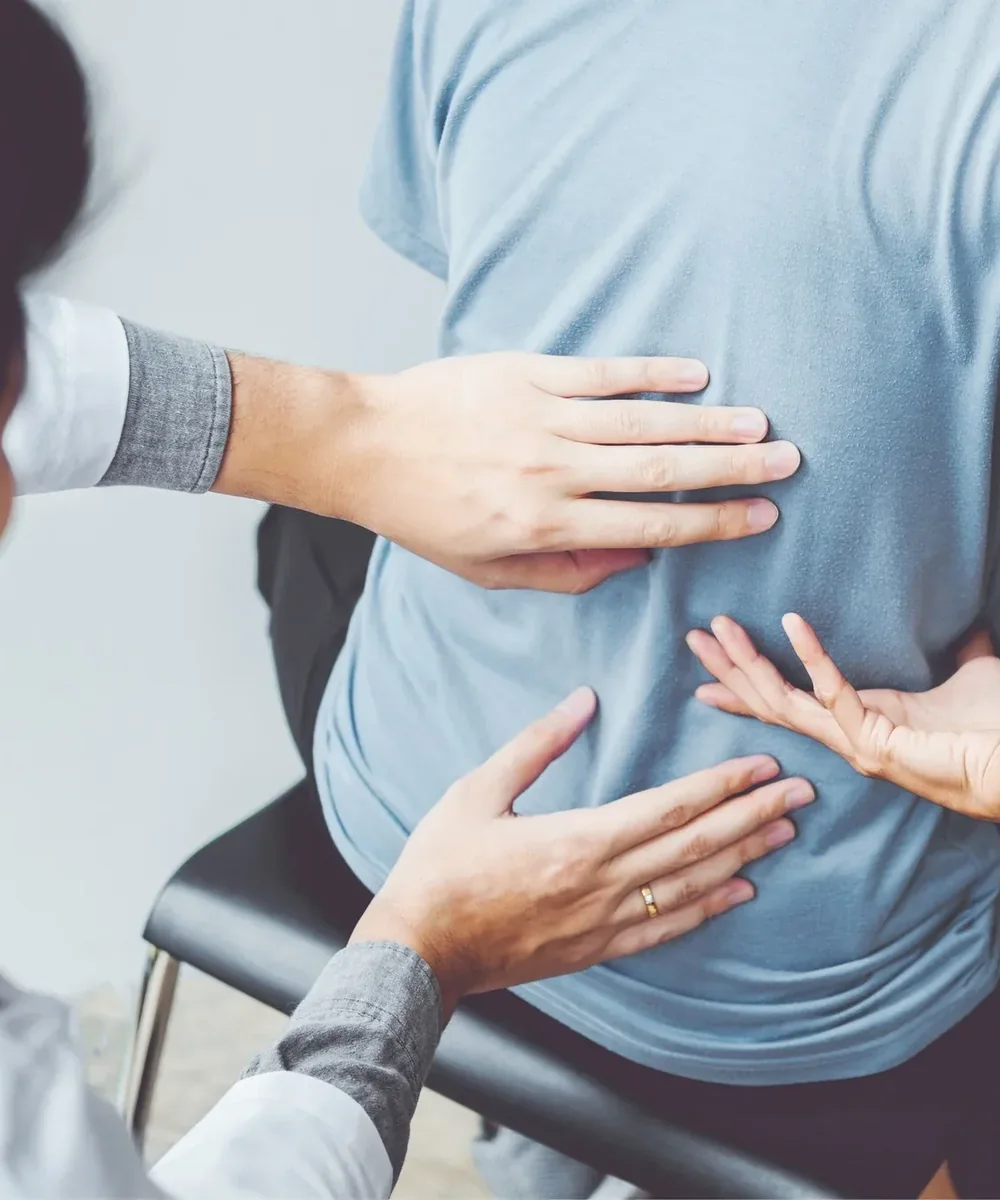 A licensed physical therapist testing a patient&rsquo;s low back and leg movement at King Physical Therapy and Fitness in Connellsville, PA