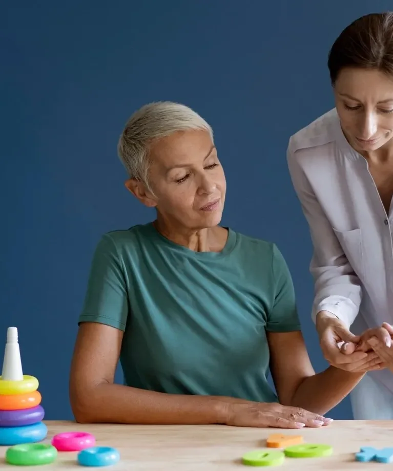 A licensed physical therapist testing a patient&rsquo;s grip and forearm during an elbow and wrist evaluation at King Physical Therapy and Fitness in Connellsville, PA