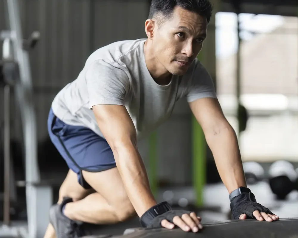 An athlete performing a return-to-sport hop test while a licensed physical therapist watches the landing mechanics at King Physical Therapy and Fitness in Connellsville, PA