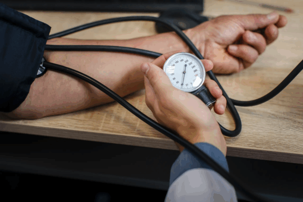 male-doctor-hand-measuring-tension